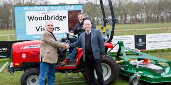 Andy-Rayner-R-TNS-Groundcare-Sales-Manager-hands-over-tractor-to-Bob-Double-L-WRUFC-Projects-Manager-Garry-Sykes-on-tractor-WRUFC-Head-Groundsman